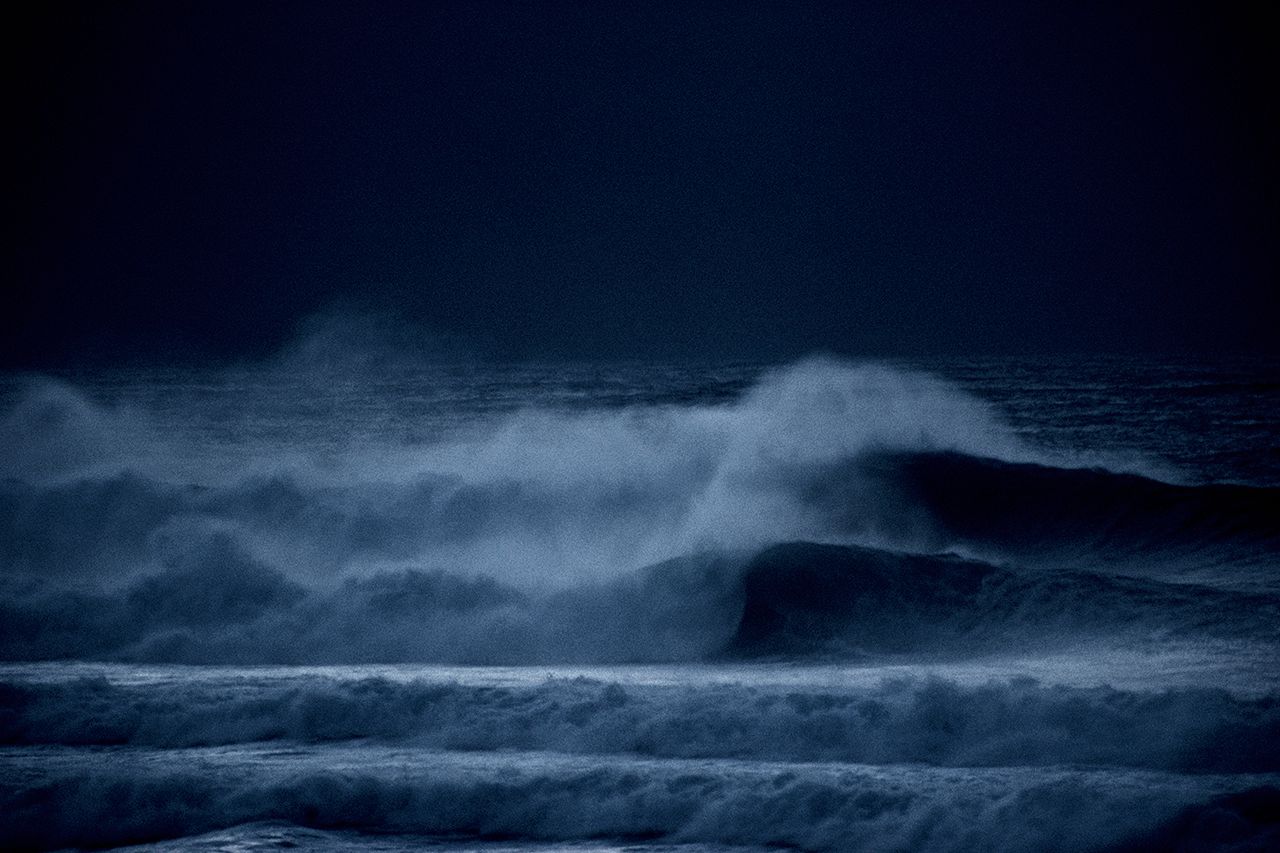 Full frame image of waves rolling forth in the dark of night